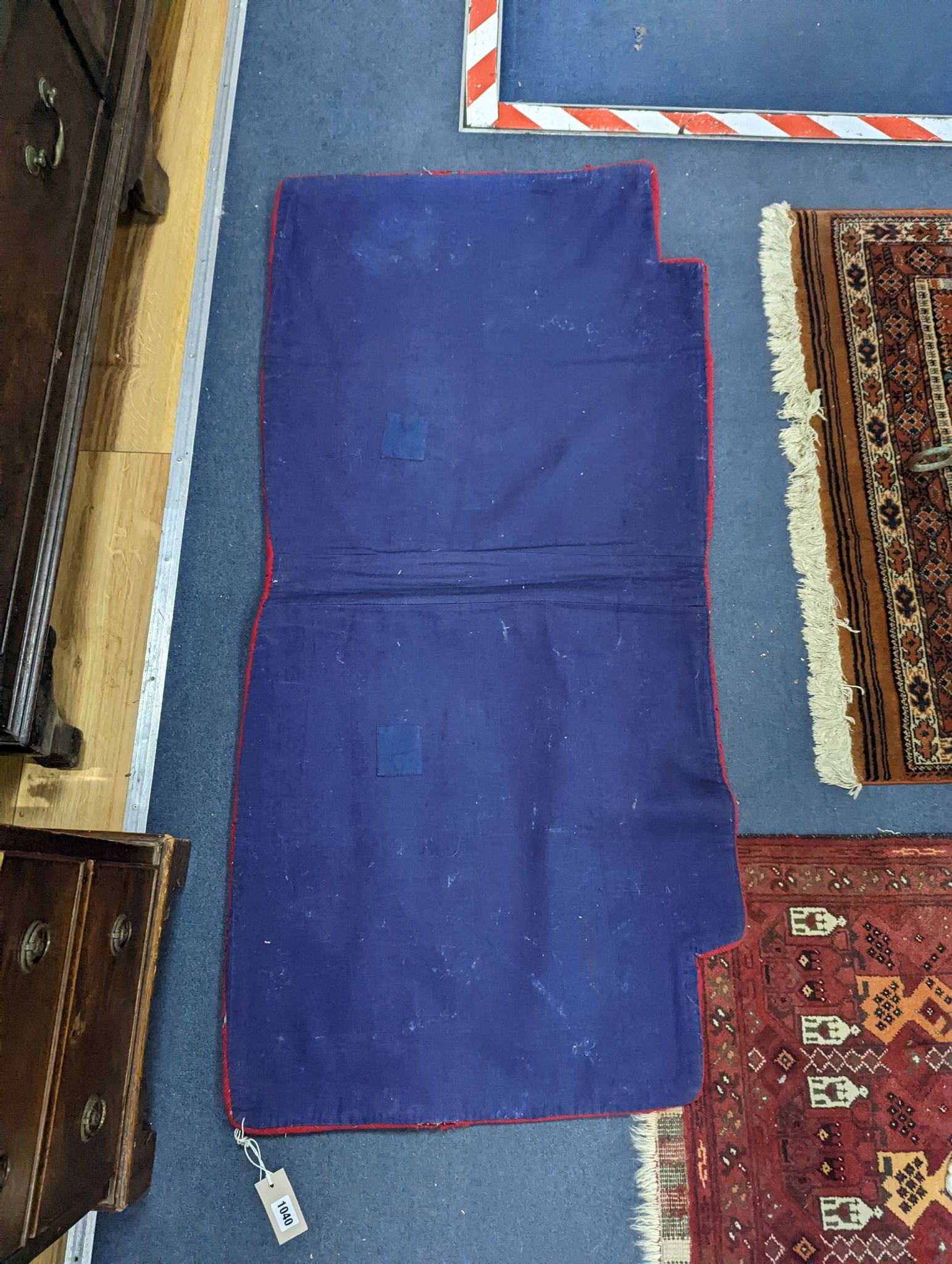 An antique Tibetan saddle cover, 132 x 64cm